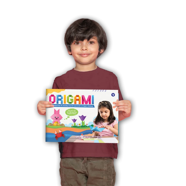 Smiling young boy holding Target Publications' Origami Book for Kids, featuring colorful illustrations and paper folding models on the cover.