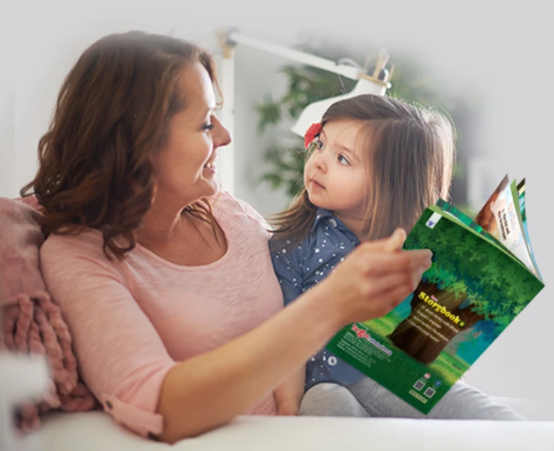 Mother and young daughter sharing a quiet reading moment together on the couch with a colourful storybook, fostering screen-free bonding, early literacy, and emotional development.